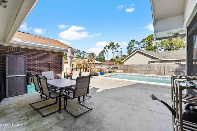 view of patio featuring a fenced in pool