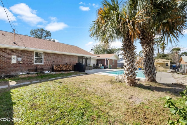 view of yard with a fenced in pool and a patio area