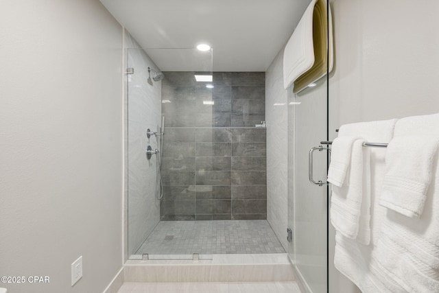 bathroom with a shower with shower door