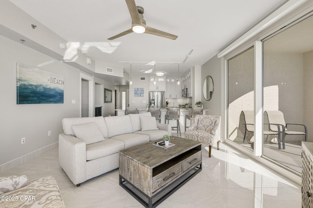 living room featuring ceiling fan