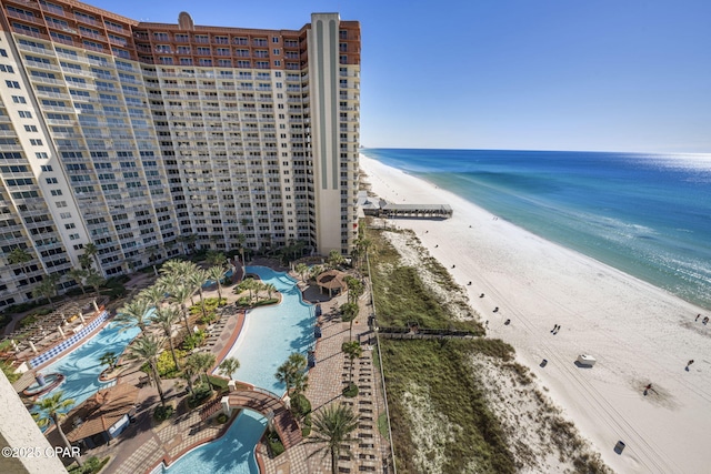 bird's eye view with a water view and a view of the beach