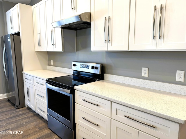 kitchen with dark hardwood / wood-style flooring, appliances with stainless steel finishes, white cabinets, and light stone counters