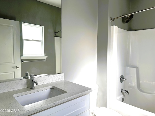 full bathroom with vanity,  shower combination, and toilet