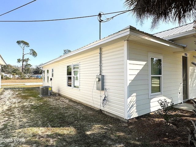 view of side of property with cooling unit