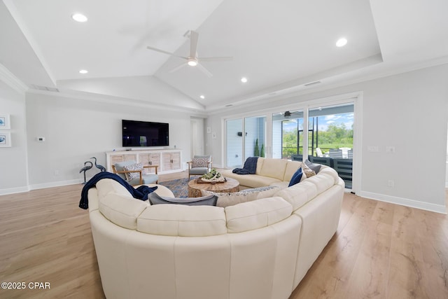 living room featuring ornamental molding, vaulted ceiling, light hardwood / wood-style floors, and ceiling fan