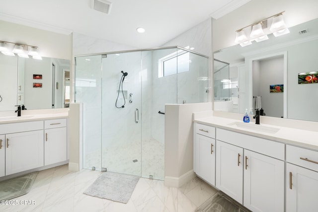 bathroom with vanity, ornamental molding, and an enclosed shower