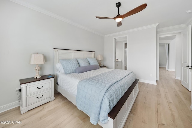 bedroom featuring ceiling fan, ornamental molding, ensuite bathroom, and light wood-type flooring