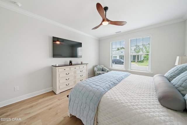 bedroom with ornamental molding, ceiling fan, and light hardwood / wood-style flooring