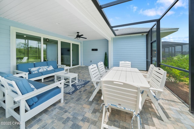 sunroom featuring ceiling fan