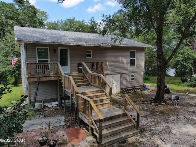 11413 Church Rd, Ebro, FL 32437 - rear view of property with stairway and roof with shingles