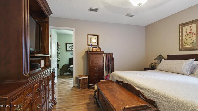 laundry room with cabinets, separate washer and dryer, and water heater