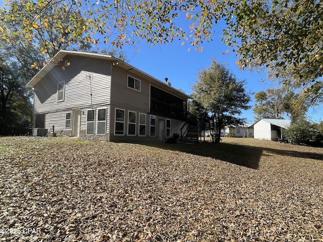 back of house with cooling unit