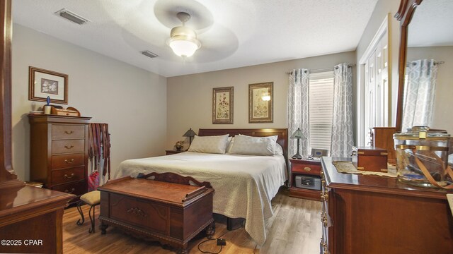 11413 Church Rd, Ebro, FL 32437 - bedroom featuring light wood-style floors and ceiling fan