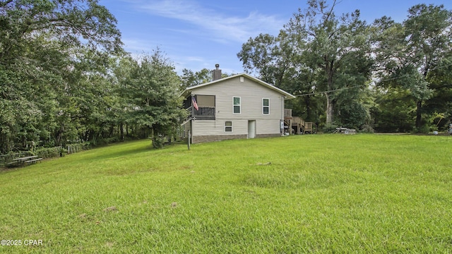11413 Church Rd, Ebro, FL 32437 - view of property exterior featuring stairs, a chimney, a yard, and a deck