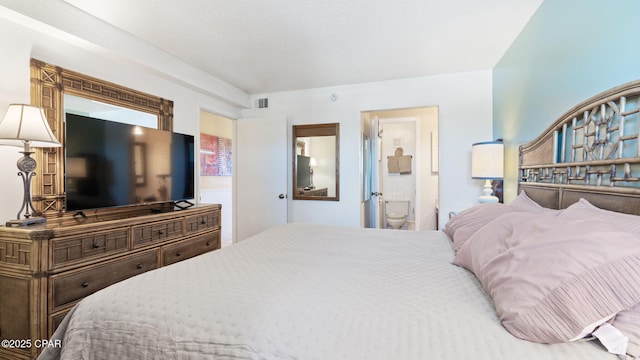 bedroom featuring ensuite bathroom