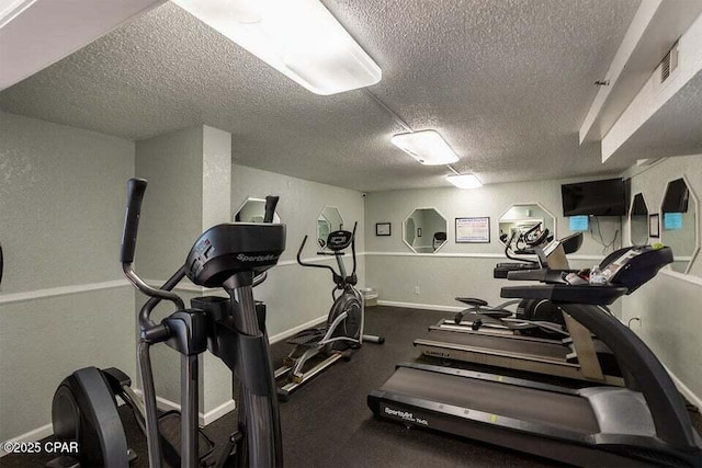 workout area with a textured ceiling