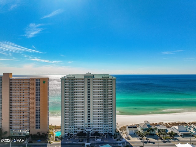 aerial view featuring a water view and a beach view