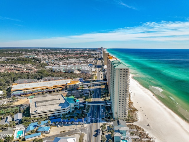 birds eye view of property with a beach view and a water view