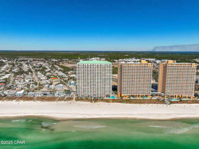 birds eye view of property featuring a water view and a view of the beach