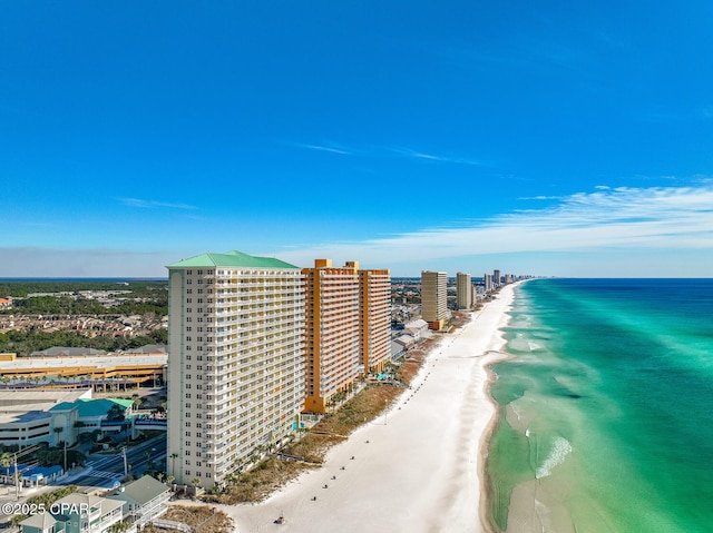 bird's eye view featuring a water view and a beach view