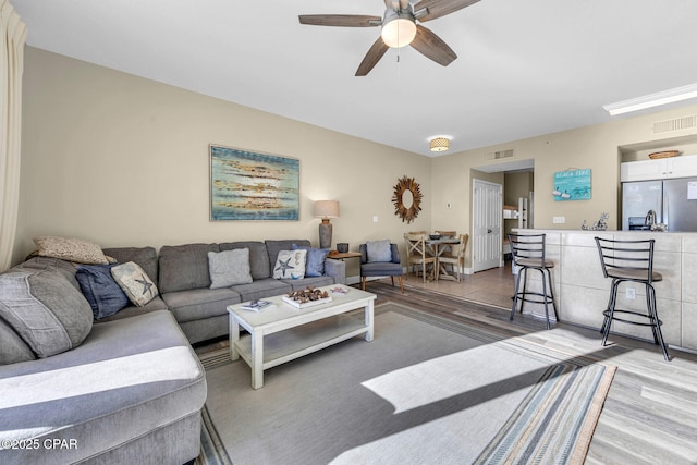 living room featuring ceiling fan