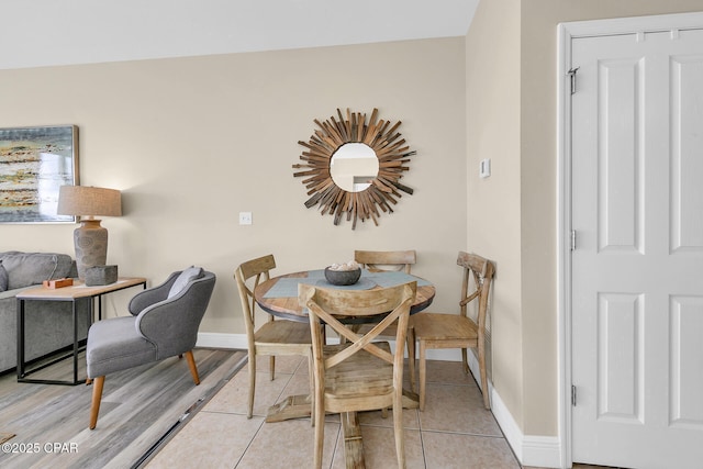 dining room featuring light tile patterned flooring