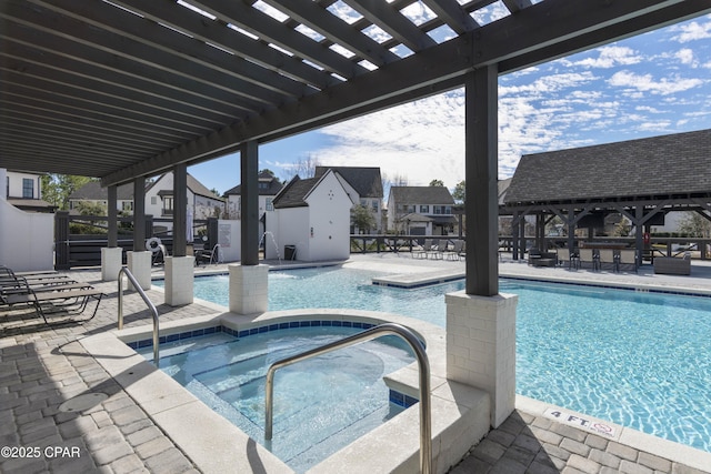 view of pool featuring a hot tub, a pergola, and a patio