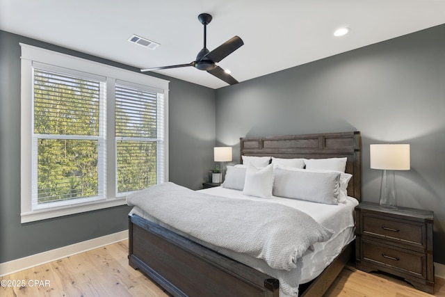 bedroom featuring ceiling fan and light hardwood / wood-style flooring