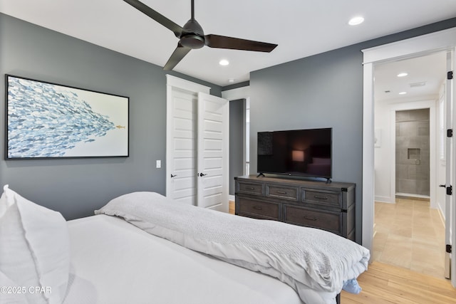 bedroom featuring ceiling fan and light hardwood / wood-style floors