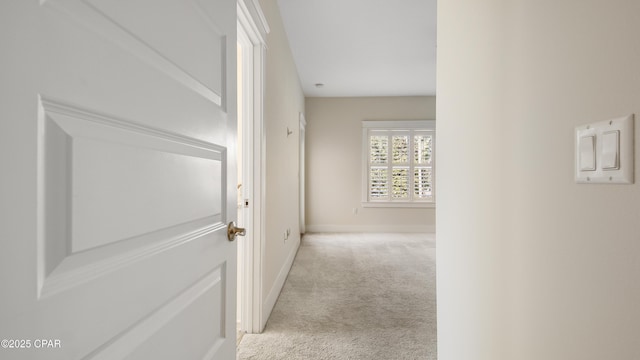 hallway with light carpet