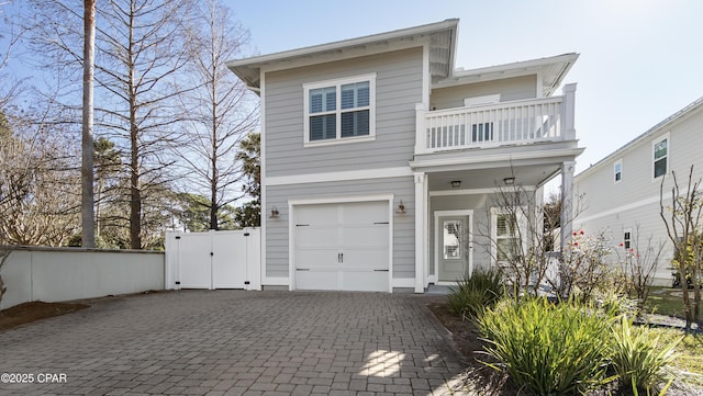 view of front of house with a balcony and a garage