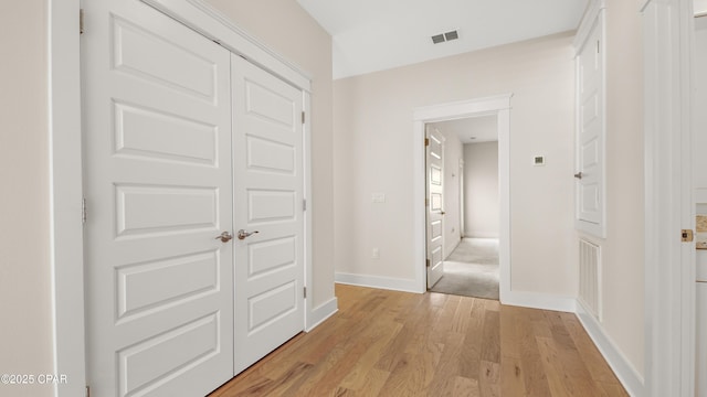 hall with light wood-type flooring