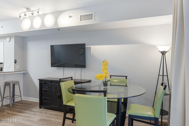 dining room featuring light hardwood / wood-style flooring