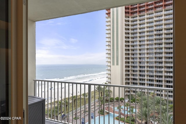 balcony with a beach view and a water view