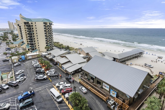 drone / aerial view featuring a view of the beach and a water view