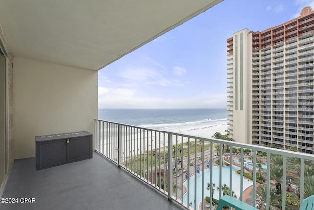 balcony with a view of the beach and a water view