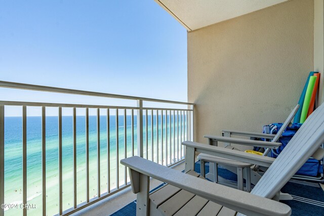 bird's eye view featuring a water view and a view of the beach