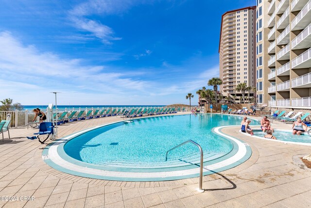 view of property's community featuring a water view and a view of the beach