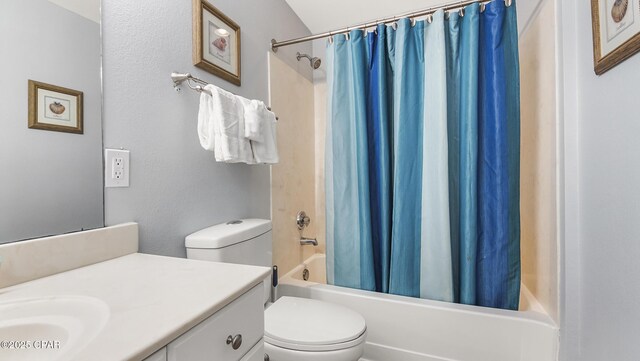 full bathroom with shower / bath combination with curtain, vanity, and toilet