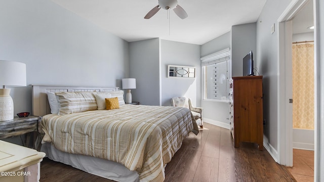 bedroom with dark hardwood / wood-style flooring and ceiling fan