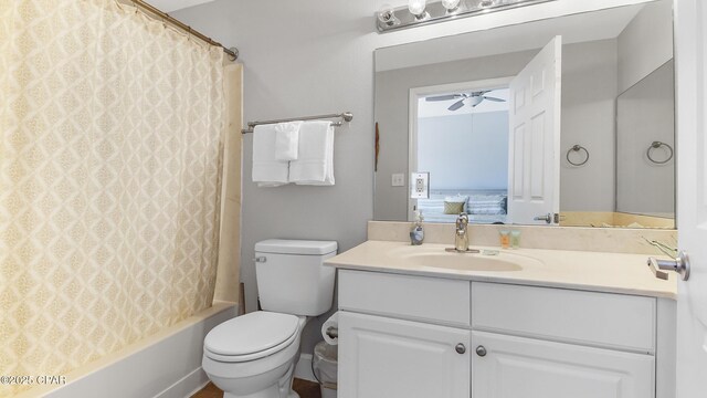 full bathroom featuring vanity, shower / bathtub combination with curtain, ceiling fan, and toilet