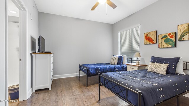 bedroom featuring hardwood / wood-style floors and ceiling fan