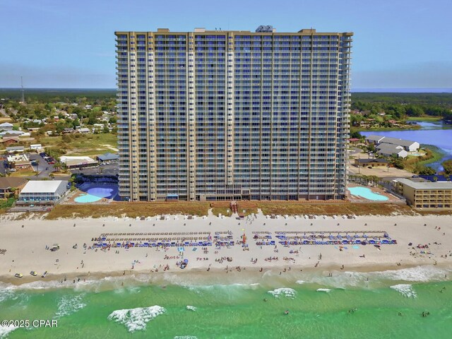 bird's eye view featuring a beach view and a water view