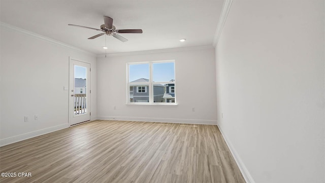 empty room with crown molding, ceiling fan, light wood-style flooring, and baseboards