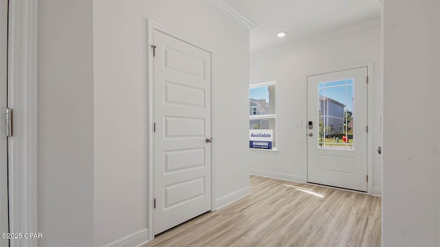 doorway featuring baseboards, light wood finished floors, recessed lighting, and crown molding