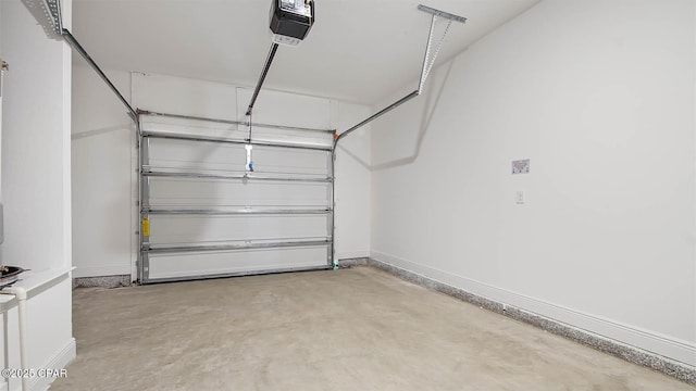 garage featuring baseboards and a garage door opener