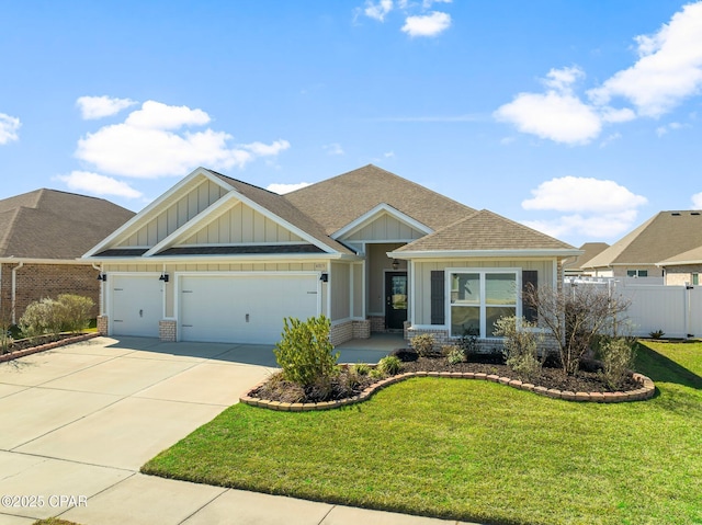 craftsman inspired home with driveway, roof with shingles, an attached garage, a front lawn, and board and batten siding