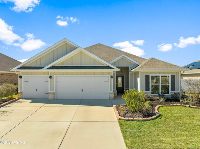 craftsman inspired home featuring a garage, driveway, roof with shingles, and brick siding