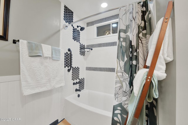 bathroom featuring shower / bathtub combination with curtain