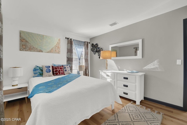 bedroom with light hardwood / wood-style flooring